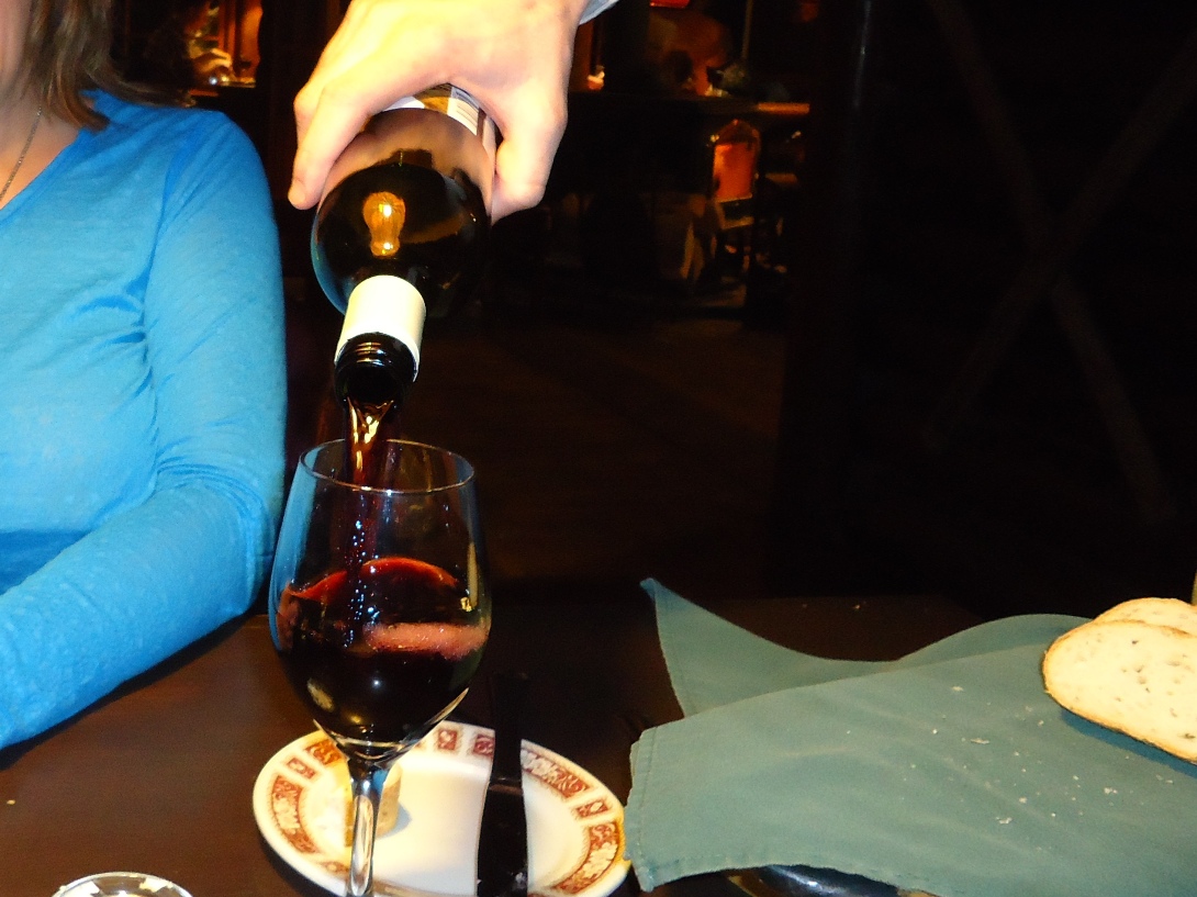 Enjoying a glass of Blue Mountain Pinot Noir at Storm Mountain Lodge
