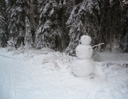 Last year\'s snowman watched over the trail for the entire winter