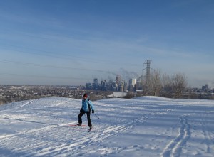 Liz on the Shaganappi golf course with Calgary behind her!