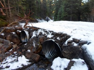 Two huge culverts take the water from Spotted Wolf creek under the trail