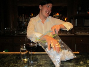 The bartender at Emerald Lake Lodge makes the draw for two free nights at the lodge