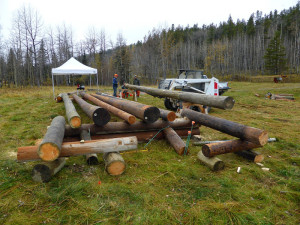 Volunteers pre-cutting and assembling the bridge at the West Bragg Creek parking lot