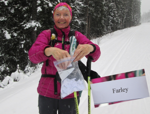 Helen Read draws the lucky winner's name.  Farley Klotz is the winner of two free nights at Mountaineer Lodge in Lake Louise.