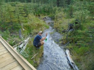 Markus, who is biking from Prudhoe Bay, Alaska to the tip of South America, stops at one of the many streams for a refresher. 